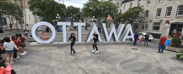 Daniel and Silvia getting ready for BTF 2022 at the famous Ottawa sign